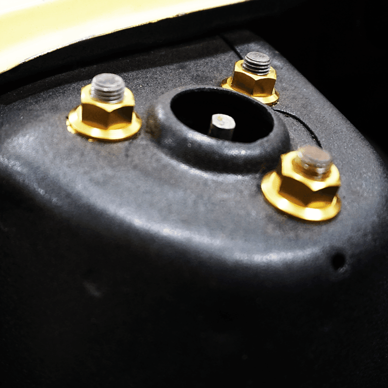 Cargue la imagen en el visor de la galería, ZSPEC titanium gold dress-up nuts installed on a Datsun S30 (240z/260z/280z) strut tower mount.