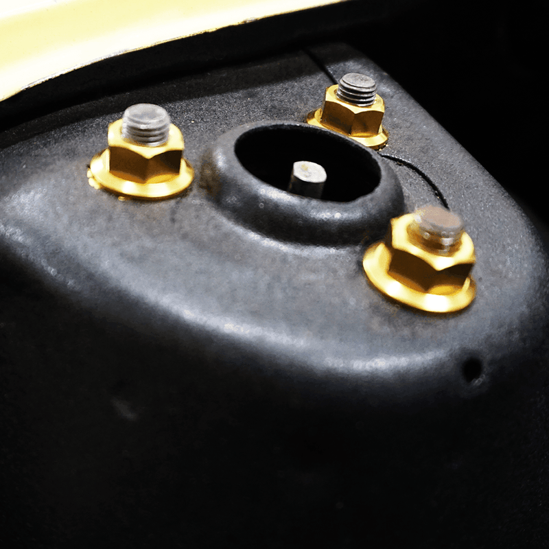 Load image into Gallery viewer, Gold ZSPEC titanium strut tower bolts installed on a '70-'78 Datsun S30 chassis.