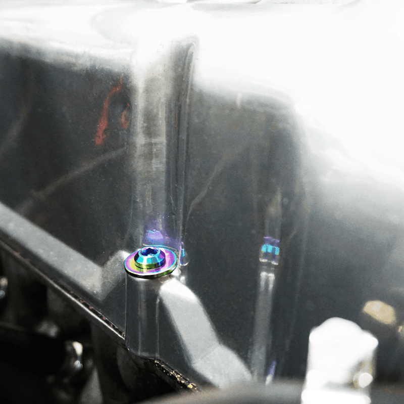 Load image into Gallery viewer, Burnt titanium ZSPEC valve cover fastener installed on an L-series Datsun engine.
