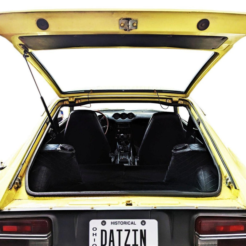 Load image into Gallery viewer, ZSPEC titanium fastener kit installed on a yellow Datsun S30 240/260/280Z trunk area.