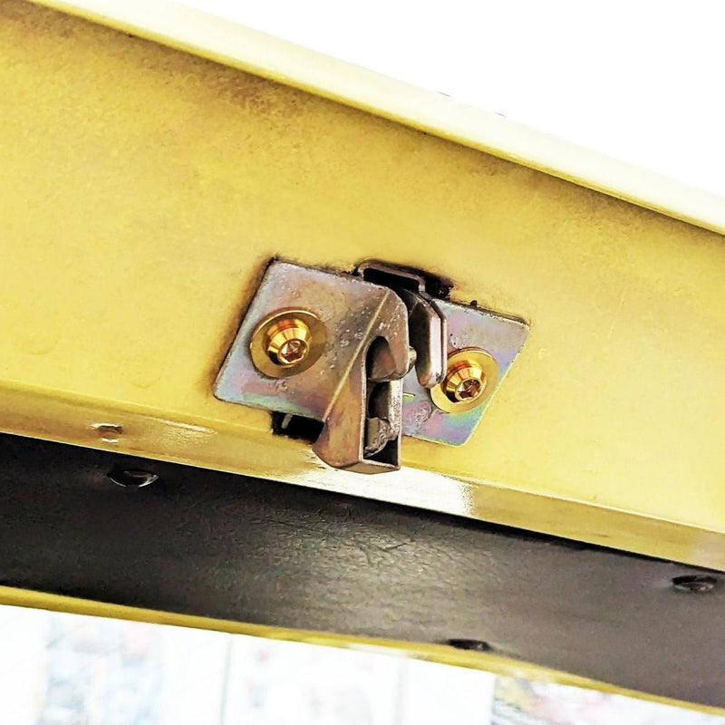 Load image into Gallery viewer, ZSPEC titanium trunk fastener kit installed on a Datsun S30 hatch latch, featuring polished gold-tone finish.