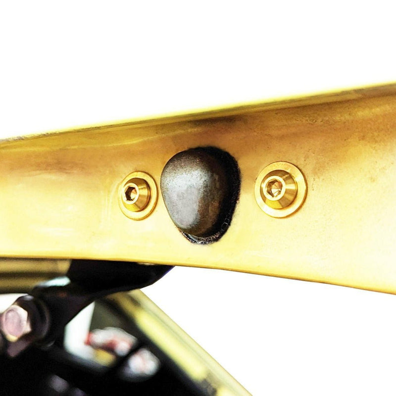 Load image into Gallery viewer, ZSPEC titanium fastener kit installed on a Datsun S30 trunk hatch, featuring two polished gold-tone finish bolts.