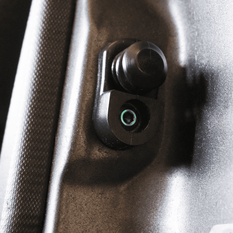 Load image into Gallery viewer, ZSPEC titanium fastener kit installed in a Nissan S13 door jam area, featuring a sleek metallic bolt head.