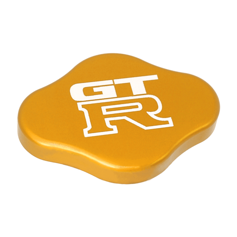 Load image into Gallery viewer, Gold ZSPEC billet radiator cap cover for Nissan GT-R R32-R35 with white GT-R logo.