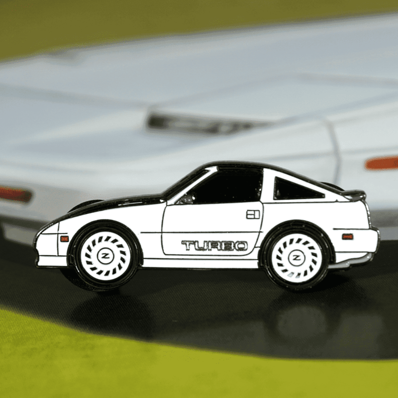 Load image into Gallery viewer, White Z31 Nissan 300ZX Turbo lapel pin featuring the Shiro Tribute design with signature white wheels.