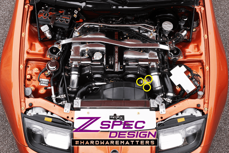 Load image into Gallery viewer, Titanium ZSPEC Crank Angle Sensor bolts installed on a Nissan Z32 engine bay, highlighted with yellow circles.