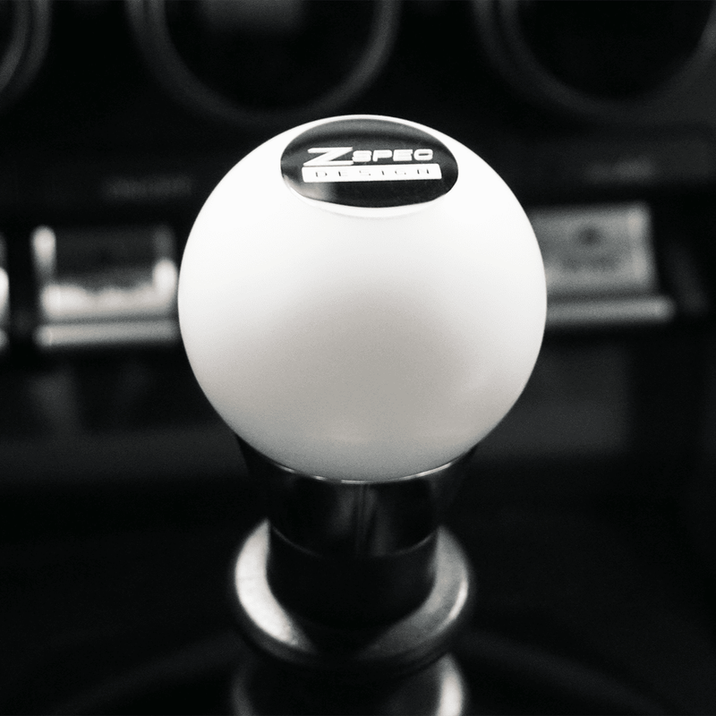Load image into Gallery viewer, White ZSPEC round shift knob for 300ZX, 240SX, 3000GT, R32-R34; features black ZSPEC logo branding.