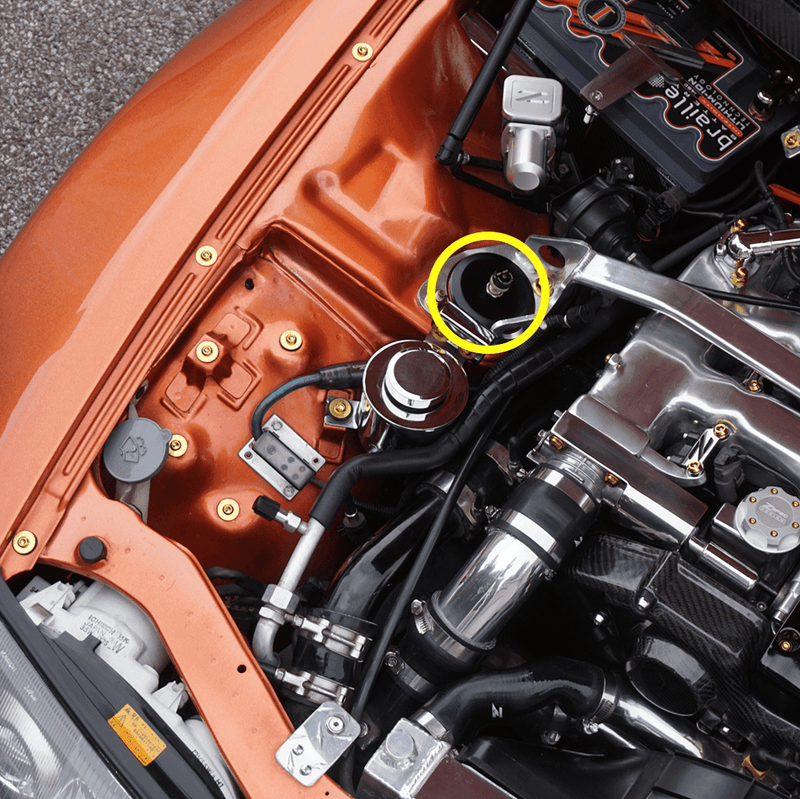 Load image into Gallery viewer, ZSPEC black billet shock tower cover installed on a Nissan 300ZX Z32 engine bay, highlighted with a yellow circle.