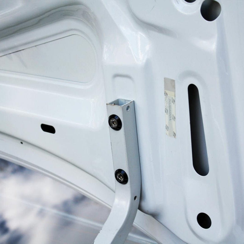 Load image into Gallery viewer, ZSPEC stainless fastener kit installed on a white Nissan 240SX S14 hood hinge with black billet finish.
