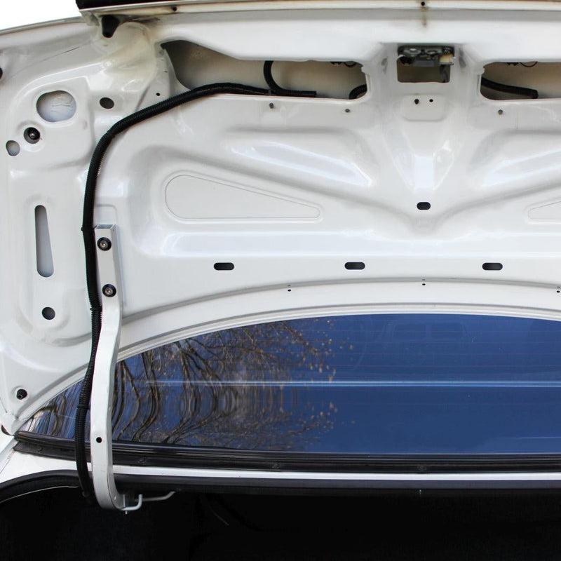 Load image into Gallery viewer, ZSPEC Stage-2 stainless fastener kit installed on a white Nissan 240SX S14 trunk hinge.