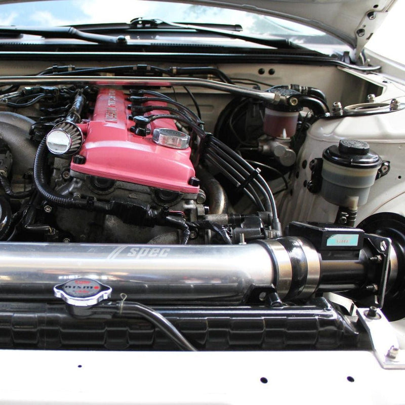 Load image into Gallery viewer, ZSPEC Stage-2 bolt kit installed on a pink Nissan S14 valve cover in a clean engine bay.