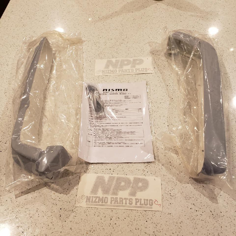 Load image into Gallery viewer, New grey Nismo S-Tune rear bumper under spoiler set for R34 GTR, in original packaging with manual.