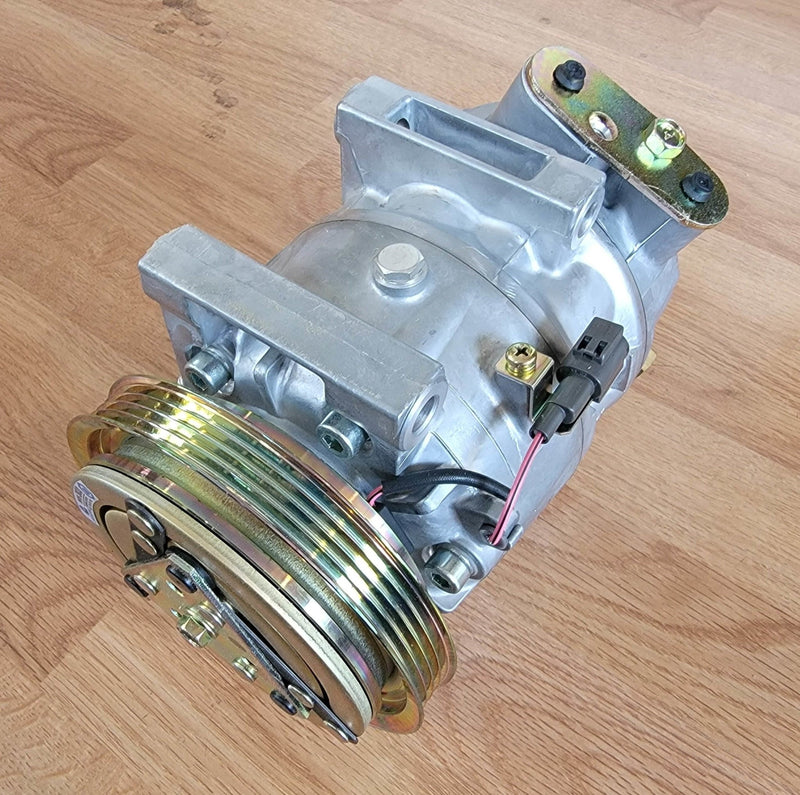 Load image into Gallery viewer, New old stock S13 240SX R134A A/C compressor. Silver metallic finish with iridescent gold pulley and mounting hardware.