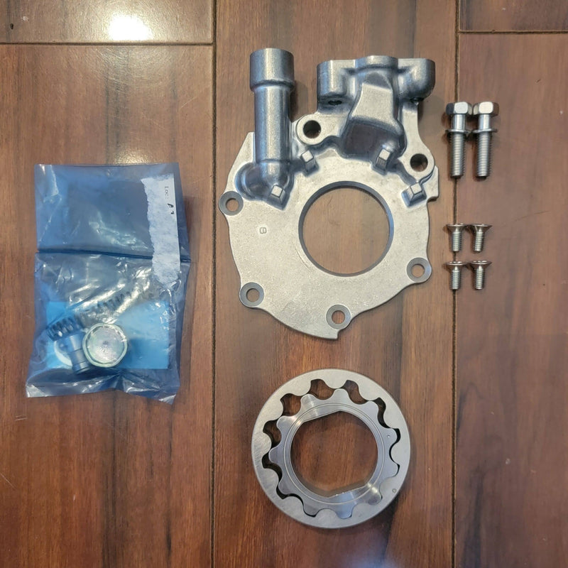 Load image into Gallery viewer, New Nissan S13 240SX KA24DE oil pump kit including aluminum pump housing, rotor, bolts, and hardware in a sealed bag.