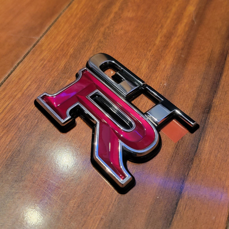 Load image into Gallery viewer, Nissan R34 Skyline GT-R Trunk Rear Emblem - NizmoPartsPlug