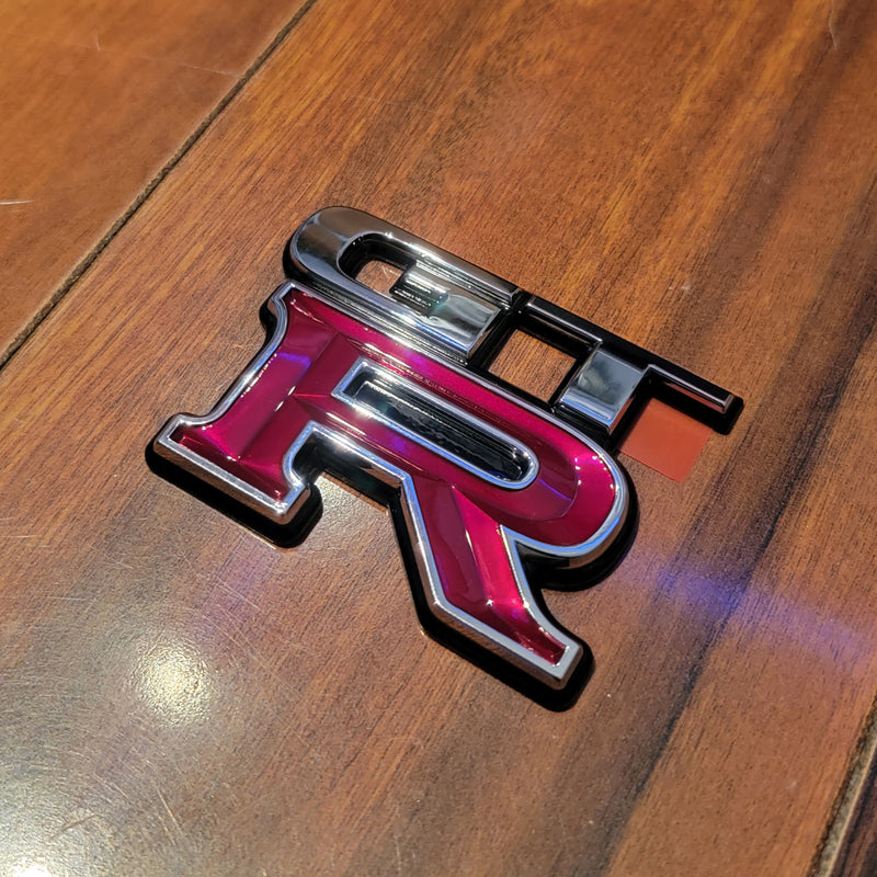 Load image into Gallery viewer, Nissan R34 Skyline GT-R Trunk Rear Emblem - NizmoPartsPlug
