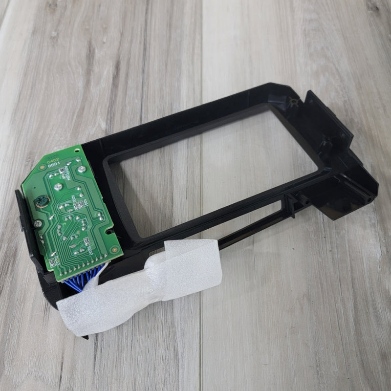 Load image into Gallery viewer, R34 Skyline GTR multi-function display controller housing with green circuit board and blue wiring on wood floor.
