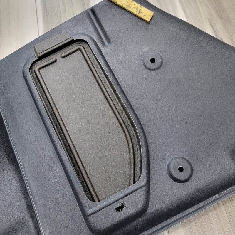 Load image into Gallery viewer, Black R34 GTR left trunk wheel housing interior trim piece in good condition.