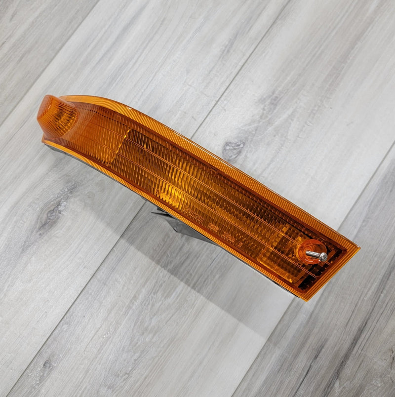 Load image into Gallery viewer, Orange LH turn signal lamp assembly for Nissan S14 Kouki in excellent, clean condition.