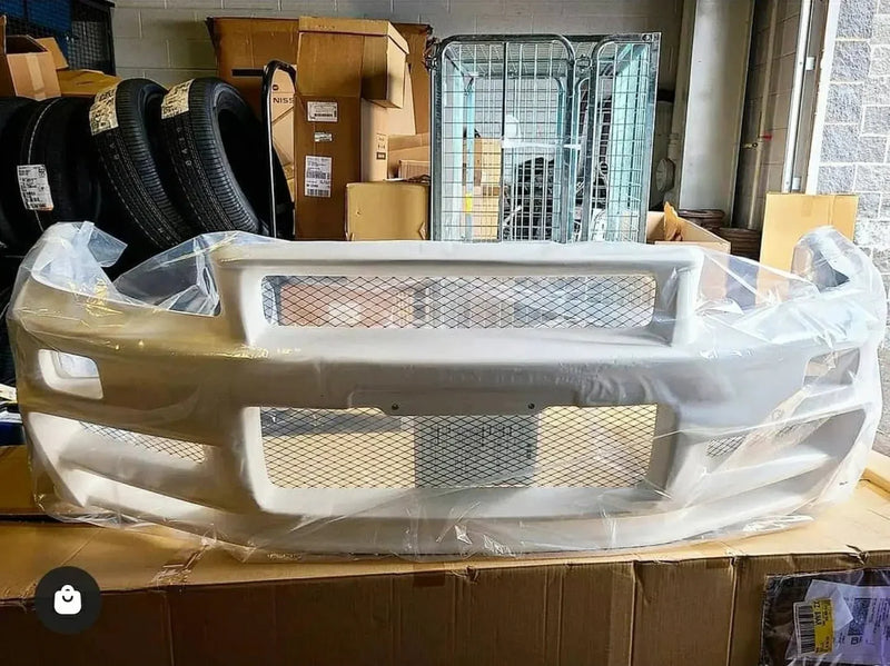 Load image into Gallery viewer, Nissan R34 Skyline GTR Z-Tune Nismo Front Bumper Assembly (Discontinued) - NizmoPartsPlug