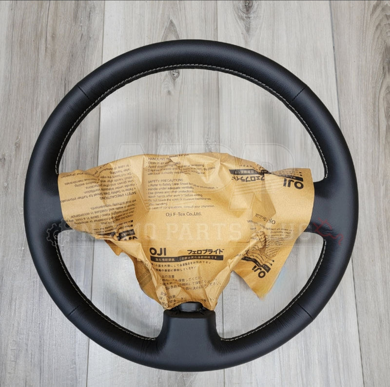 Load image into Gallery viewer, Nissan R34 Skyline GTR V-Spec Steering Wheel Assembly - NizmoPartsPlug