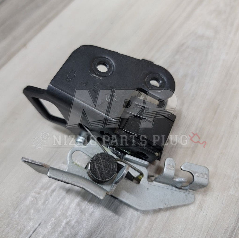 Load image into Gallery viewer, Nissan R34 Skyline trunk latch striker assembly, featuring a black metal housing and silver steel latch mechanism.