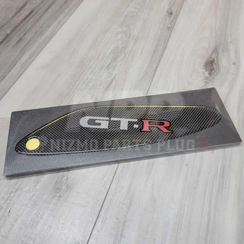 Load image into Gallery viewer, Carbon fiber air spoiler cover for Nissan R33 Skyline GTR with GT-R logo, in original packaging.
