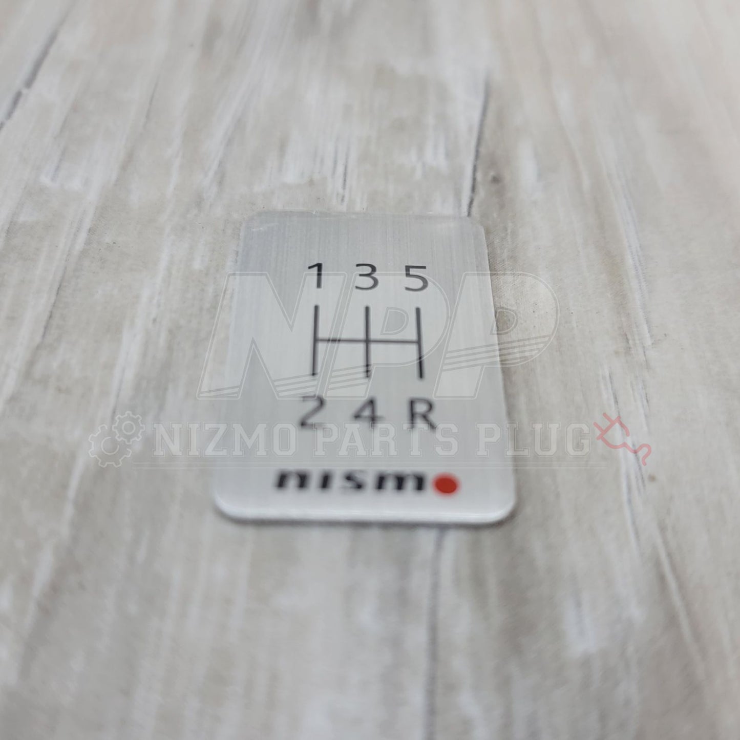 Nismo 5-Speed Manual Shift Pattern Brushed Emblem - NizmoPartsPlug