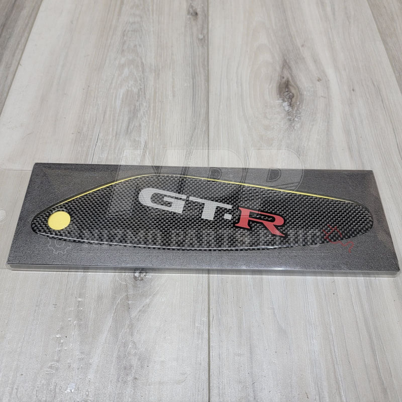 Load image into Gallery viewer, New carbon fiber air spoiler cover for Nissan R33 Skyline GTR, featuring a G.T.R logo, in protective packaging.