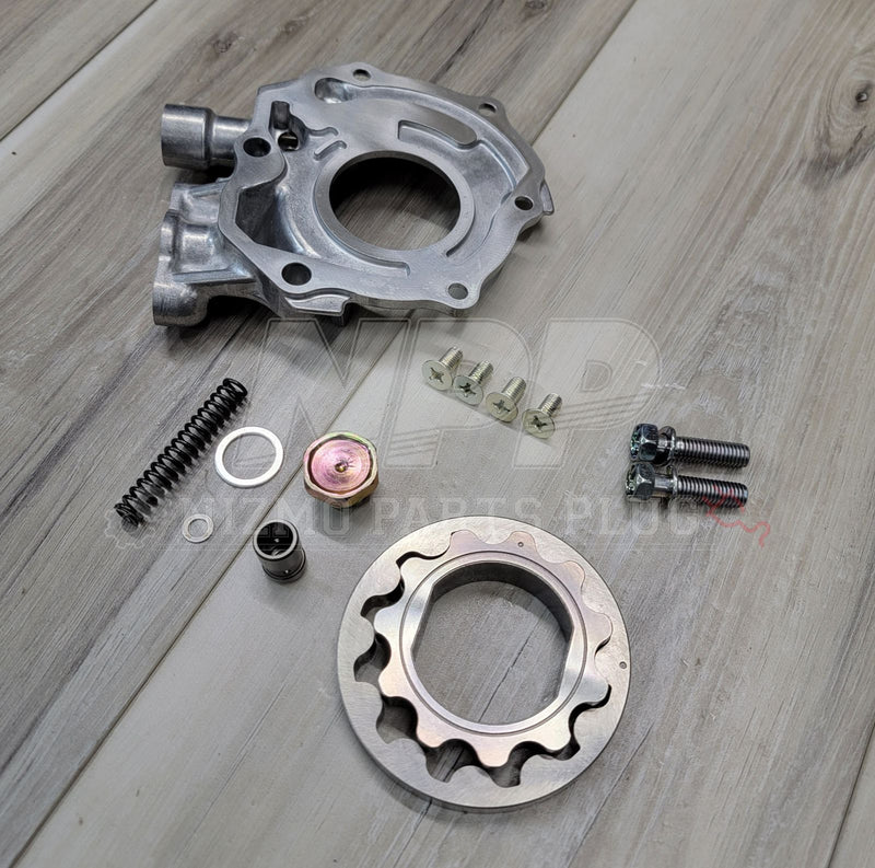 Load image into Gallery viewer, New engine oil pump kit for Nissan S13 240SX KA24DE, includes silver housing, rotor, spring, and assorted hardware.