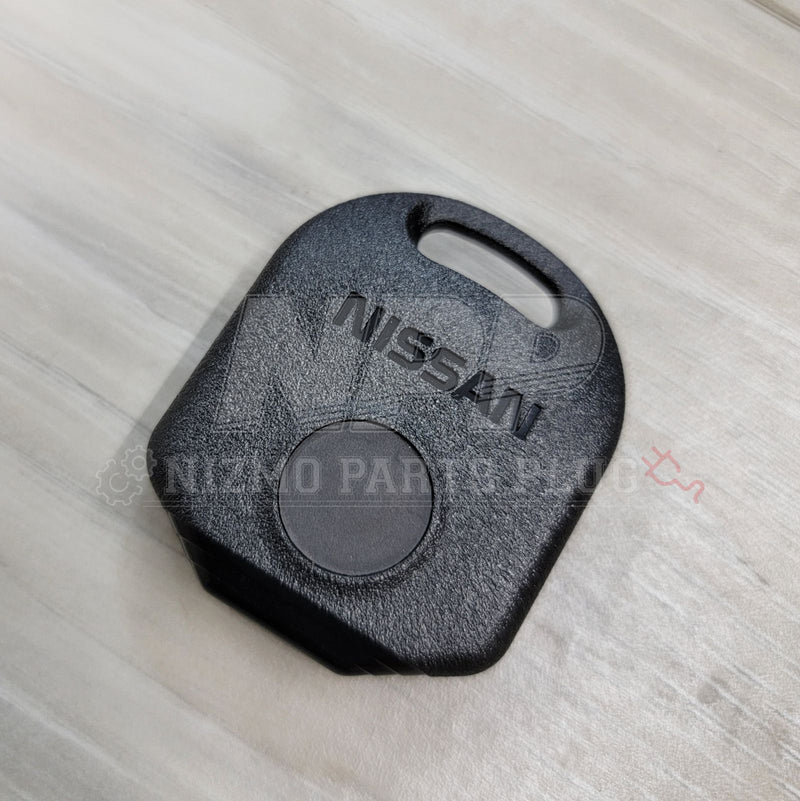 Load image into Gallery viewer, Black Nissan keyless entry remote for R33 Skyline, RPS13 180SX, and S14 Silvia with embossed logo.