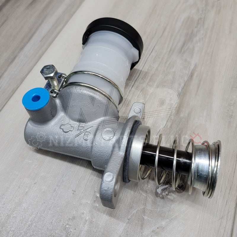 Load image into Gallery viewer, New Nissan R32/R33/R34 GTR clutch master cylinder with silver housing, white reservoir, and blue plastic cap.
