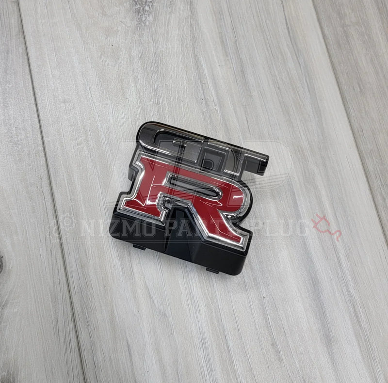 Load image into Gallery viewer, Nissan R33 Skyline GTR Front Upper Grill Emblem - NizmoPartsPlug