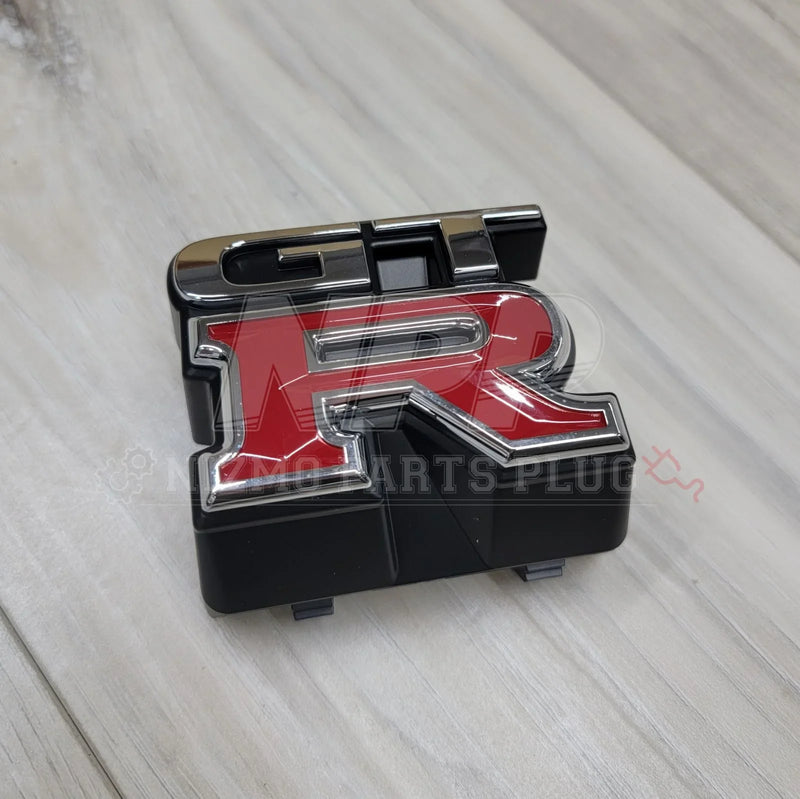 Load image into Gallery viewer, Nissan R33 Skyline GTR Front Upper Grill Emblem - NizmoPartsPlug