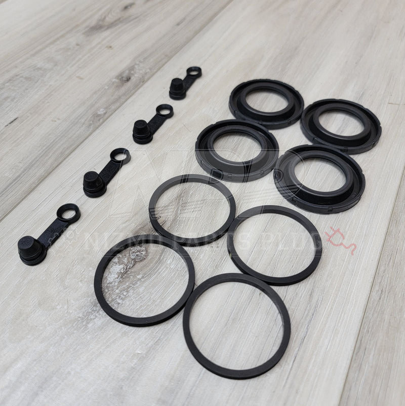 Load image into Gallery viewer, Nissan R33/34 GTR Rear Brembo Brake Caliper Seal Kit - NizmoPartsPlug