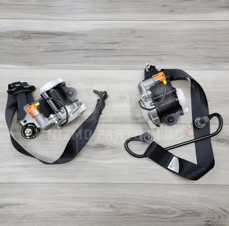 Load image into Gallery viewer, Nissan R34 Skyline GTR Front Seat Belt Retractor Pre-Tensioner Set - NizmoPartsPlug
