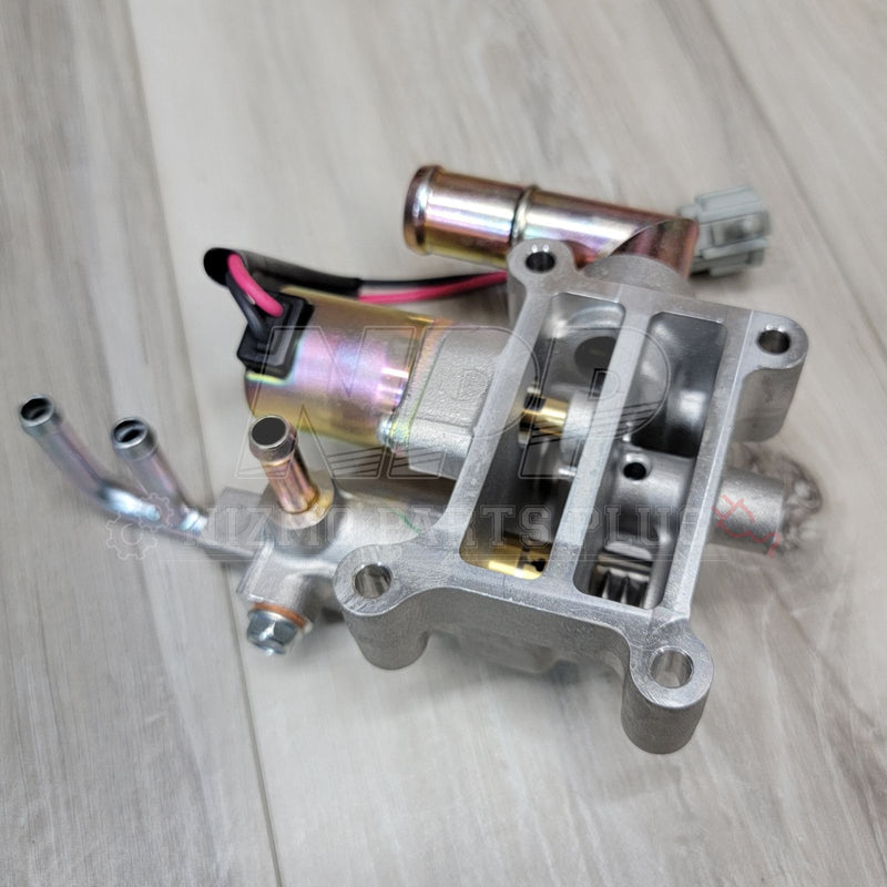 Load image into Gallery viewer, Nissan R34 Skyline RB25DET NEO idle air control valve in clean, silver metallic condition with wire connector.