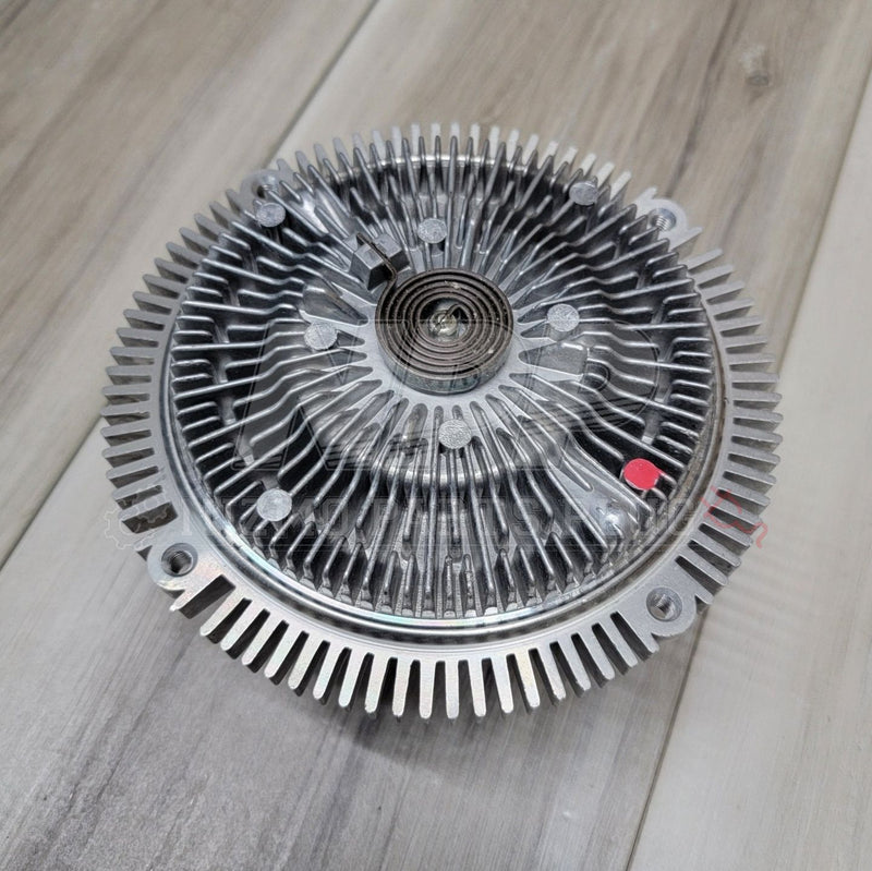 Load image into Gallery viewer, Silver Nissan Skyline R33/R34 GTR clutch fan coupler with metal cooling fins and a central spiral spring.