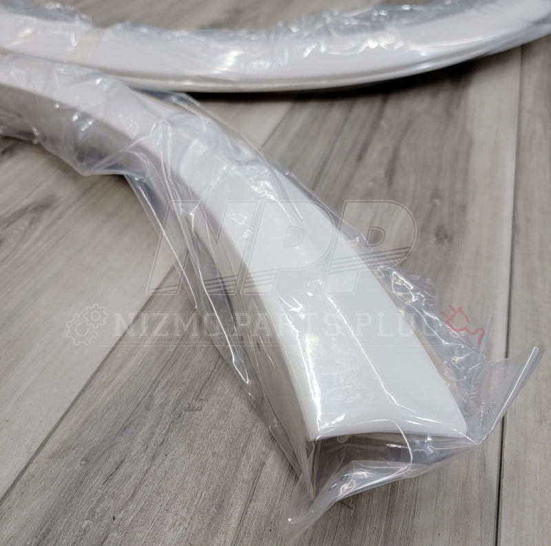 Load image into Gallery viewer, New white Nissan BNR34 GTR Nismo fender flare extension kit, factory-sealed in plastic packaging.
