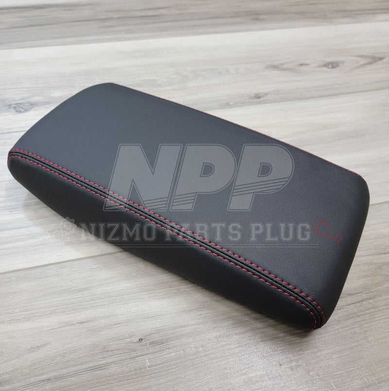 Load image into Gallery viewer, Black leather console lid for Nissan Skyline GT-R (R32/R33/R34) with red stitching, in excellent condition.