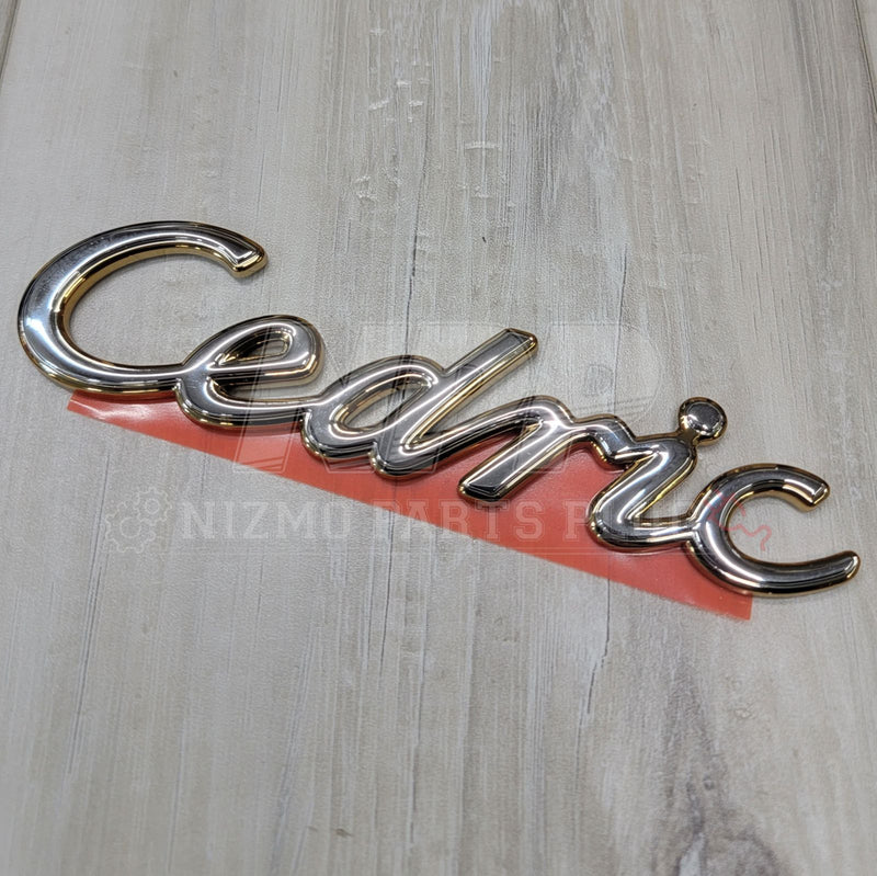 Load image into Gallery viewer, Nissan Y31 Cedric Script Front Emblem - NizmoPartsPlug