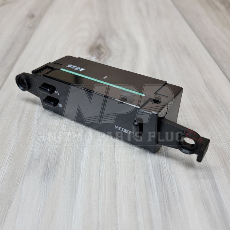 Load image into Gallery viewer, Black digital clock assembly for Nissan R32 Skyline GTR, featuring H, M, and Reset buttons. Excellent condition.