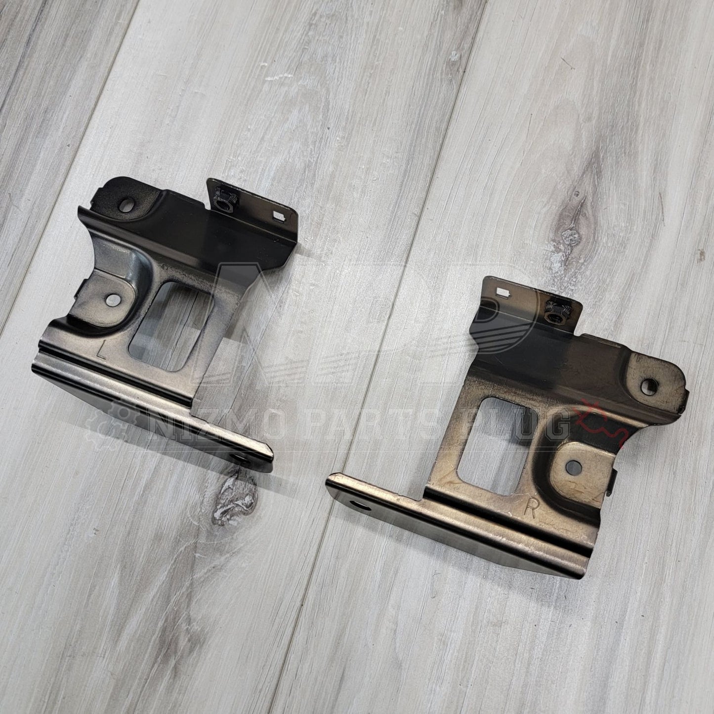 Nissan R34 Skyline GTR Headlight Bracket Set - NizmoPartsPlug