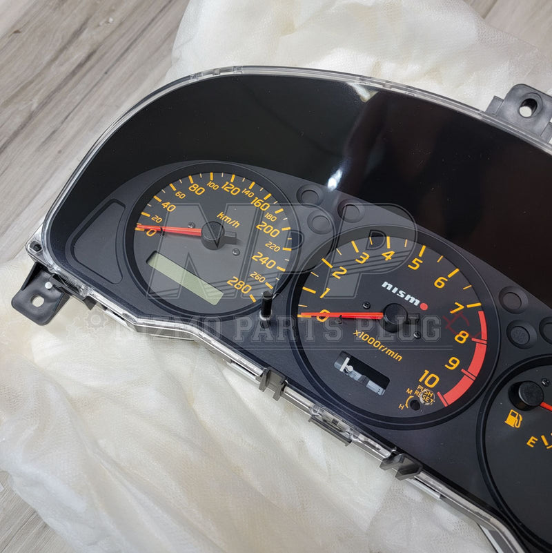Load image into Gallery viewer, Nismo combination meter assembly for Nissan S15 Silvia, featuring black gauges with yellow numbering and red needles.