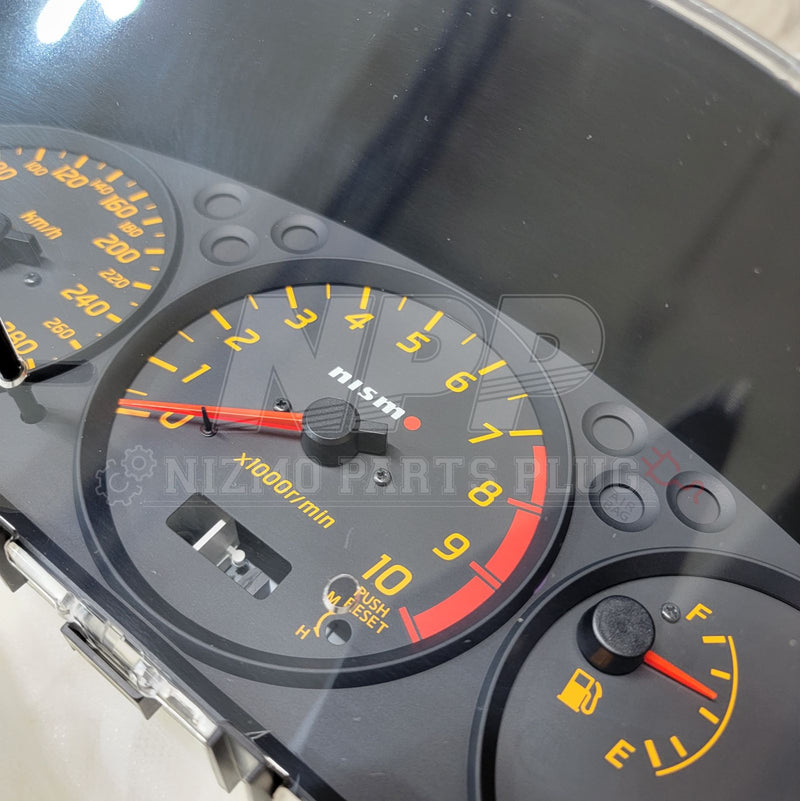 Load image into Gallery viewer, Nismo combination meter assembly for Nissan S15 Silvia, featuring black faces with yellow numbering and red needles.