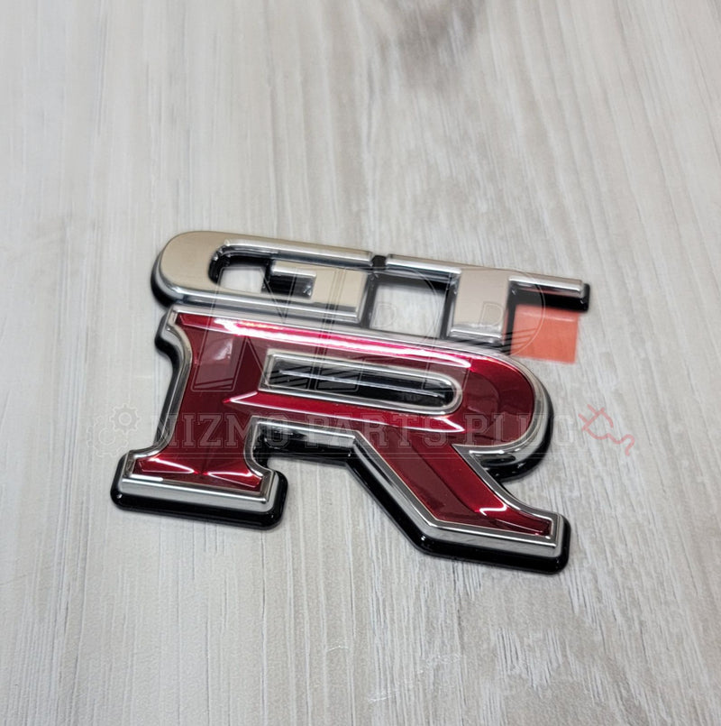 Load image into Gallery viewer, Nissan R34 Skyline GT-R Trunk Rear Emblem - NizmoPartsPlug