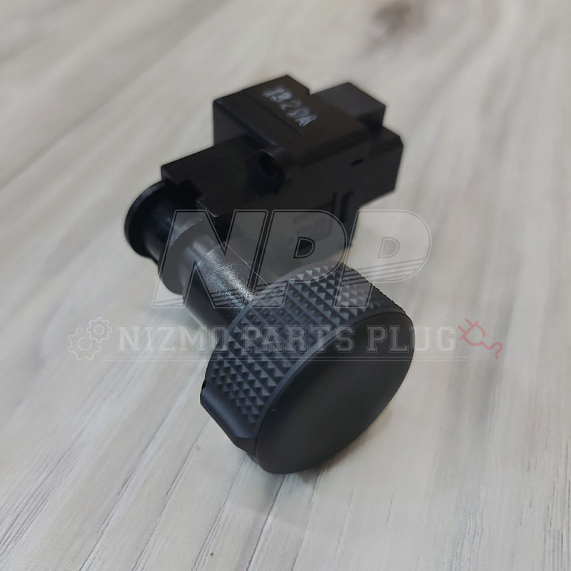 Load image into Gallery viewer, Black Nissan R32 Skyline headlight position switch assembly with a textured dial, in excellent condition.