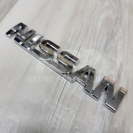 Nissan R32 Skyline "Nissan" Trunk Lid Emblem - NizmoPartsPlug