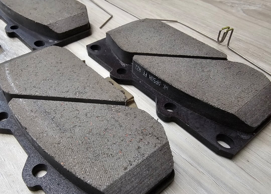 Brake pads on a wooden surface