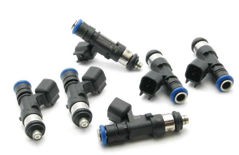 Deatschwerks RB25 TOP Feed Injectors arranged on a white background showcasing their design and quality.